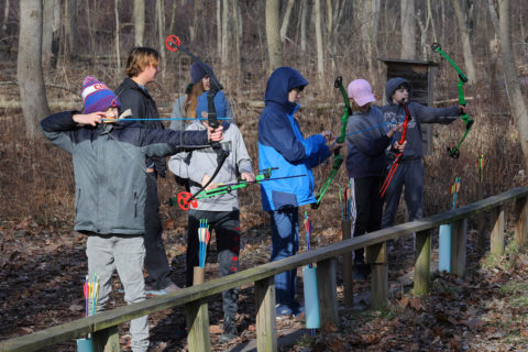 youth at the archery range
