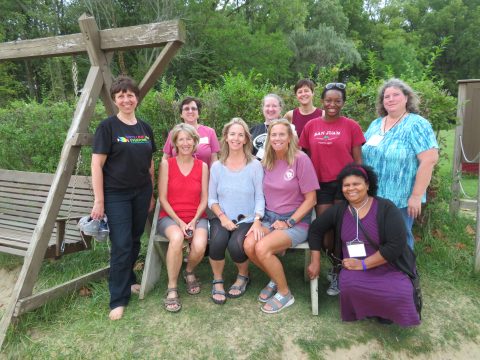 A group of women pose for a picture outisde at Women's Retreat at Camp Friedenswald.