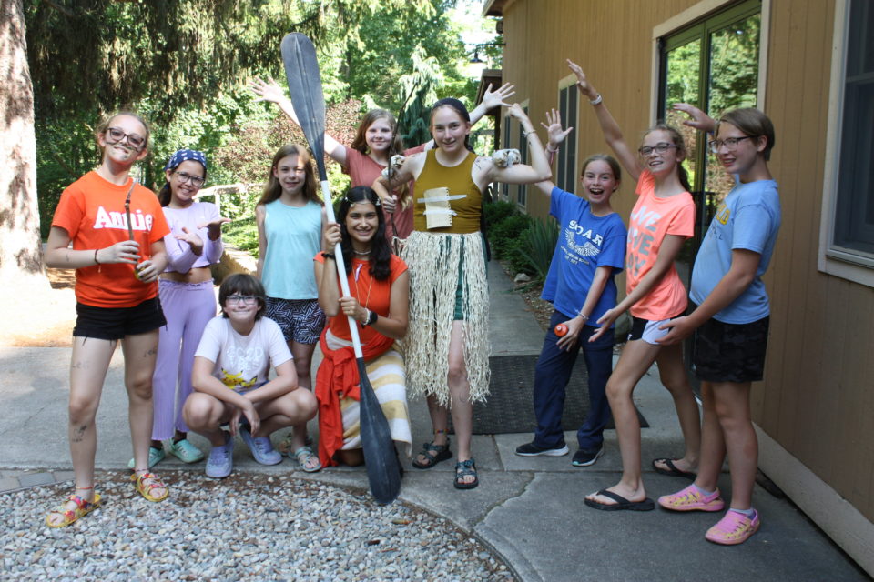 Campers and dressed up counselor