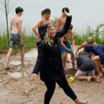 Claire leading a song in the rain