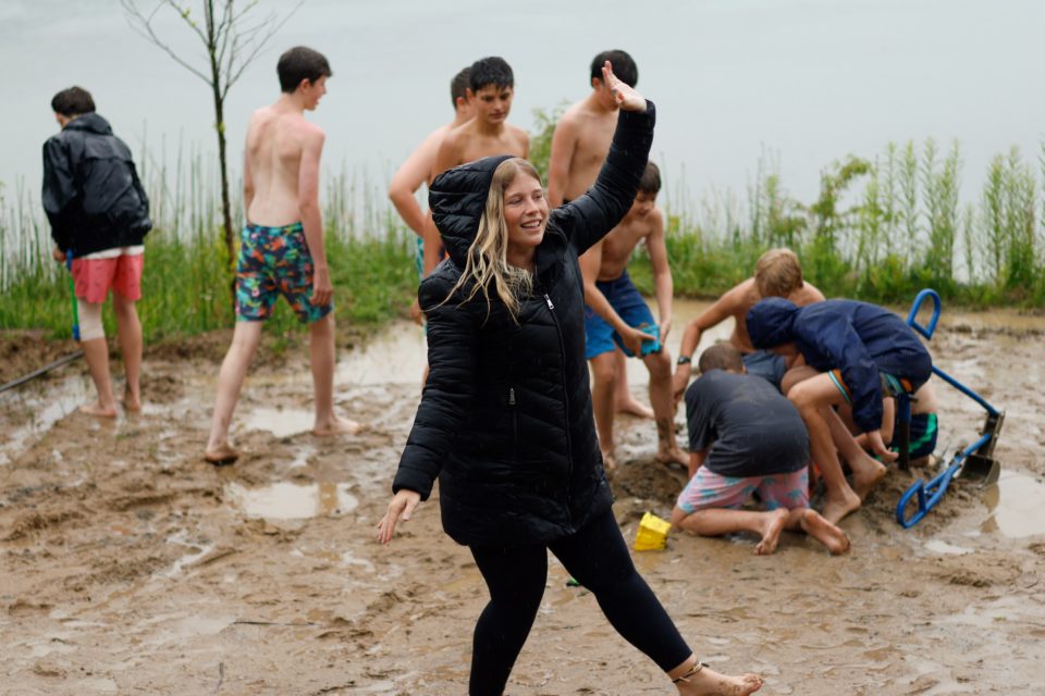 Claire leading a song in the rain